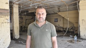 Tavanı yangın tüpüyle kırarak hem kendini hem de komşusunu kurtardı